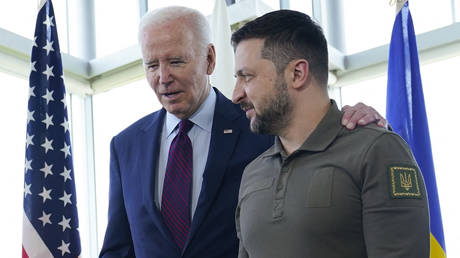 FILE PHOTO. US President Joe Biden (L) walks with Ukraine's President Volodymyr Zelensky ahead of a working session on Ukraine during the G7 Leaders' Summit in Hiroshima on May 21, 2023.