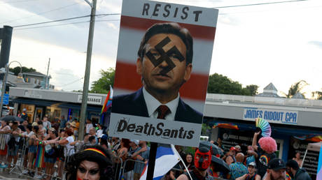 Protest against Florida Gov. Ron DeSantis during the Stonewall Pride parade on June 17, 2023 in Wilton Manors, Florida