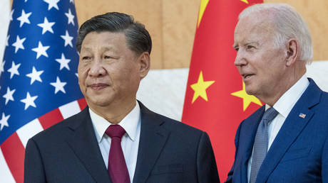FILE PHOTO. U.S. President Joe Biden, right, stands with Chinese President Xi Jinping before a meeting on the sidelines of the G20 summit meeting, Monday, Nov. 14, 2022, in Bali, Indonesia.