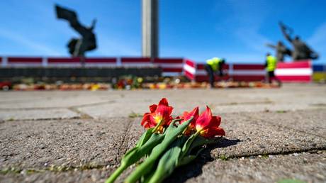 FILE PHOTO. Flowers laid at the now-destroyed monument to Liberators in Victory Park in Riga, Latvia.