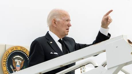 Joe Biden gestures before boarding Air Force One at Delaware Air National Guard Base in New Castle, Delaware, October 31, 2022