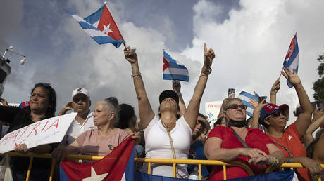 Protesters gather in front of the Versailles restaurant in the Little Havana neighborhood to show their support for the people in Cuba that have taken to the streets to protest on July 14, 2021 in Miami, Florida