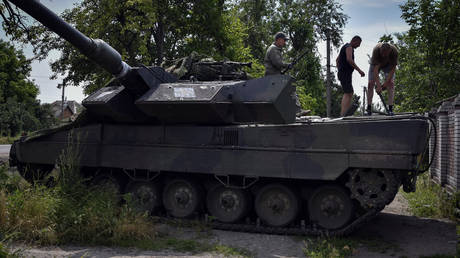 Ukrainian soldiers repair a Leopard 2 tank in Zaporozhye region, Russia, Wednesday, June 21, 2023