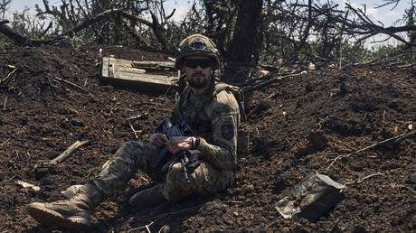 A Ukrainian soldier sits in a trench on the frontline near Bakhmut/Artyomovsk, Donetsk region, Russia, July 4 2023