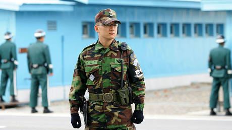 FILE PHOTO: South Korean troops stand guard in the Joint Security Area near their country's border with North Korea.