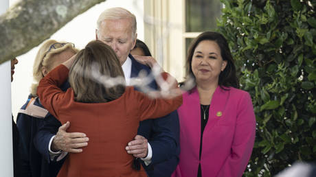 FILE PHOTO: Joe Biden hugs Nancy Pelosi during an event at the White House