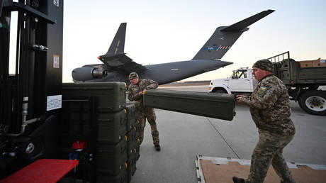 Ukrainian troops unload US-supplied Stinger missiles at Boryspol Airport in Kiev.