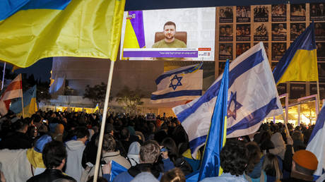 FILE PHOTO. Demonstrators gather at Habima Square in the centre of Israel's Mediterranean coastal city of Tel Aviv on March 20, 2022 to attend a televised video address by Ukraine's President Volodymyr Zelensky to the Israeli Knesset (parliament).