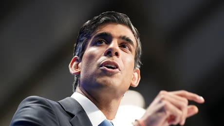 Rishi Sunak delivers his speech on day two of the Conservative Party Conference at Manchester Central Convention Complex on October 4, 2021 in Manchester, England