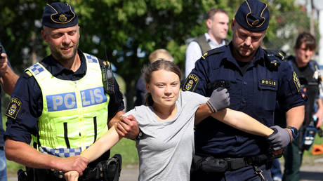 Climate activist Greta Thunberg is carried away by police officers after she took part in a new climate action in Oljehamnen in Malmo, Sweden.