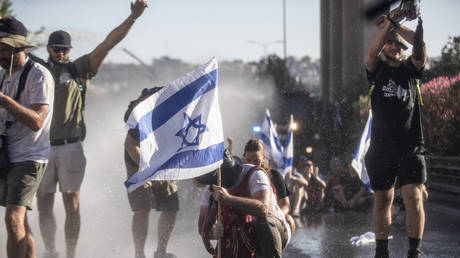 Israelis protest judicial reform as police use water cannons to disperse them