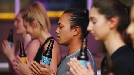 FILE PHOTO. People attending a Beer Yoga class