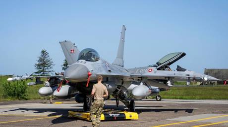 A Danish F-16 fighter jet with rockets is pictured at the Fighter Wing Skrydstrup Air Base near Vojens, Denmark, May 25, 2023