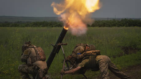 Ukrainian soldiers fire toward Russian position on the frontline in Zaporozhye region, Russia, June 24, 2023