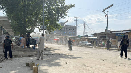 Security official cordon off the blast site in Khar, Pakistan, on July 30, 2023.