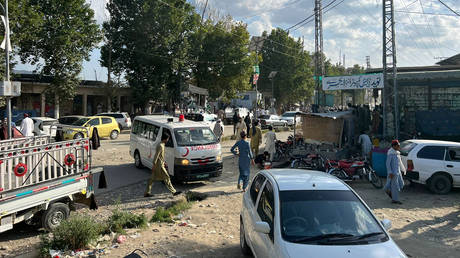 This photo taken with a mobile phone shows an ambulance arriving at the blast site in Pakistan's northwest Bajaur district on July 30, 2023.