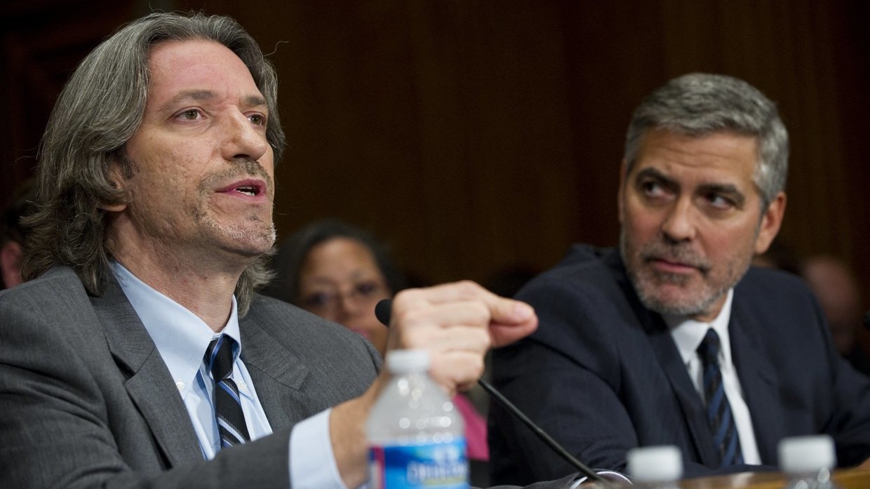 FILE PHOTO: George Clooney (R) and John Prendergast (L) testify before the Senate Foreign Relations Committee in 2012