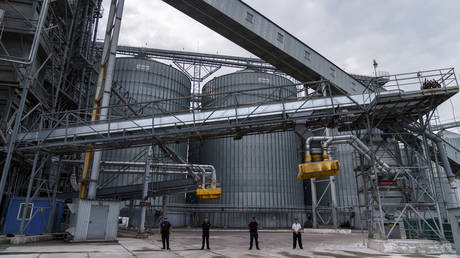 FILE PHOTO: Security personnel stand in front of a grain storage terminal at the Odesa Sea Port, in Odesa, Ukraine, July 29, 2022.