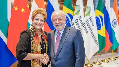 FILE PHOTO: Brazilian President Luiz Inacio Lula da Silva (R) and ex-President Dilma Rousseff (L), after she took office as the head of New Development Bank, a BRICS financial institution