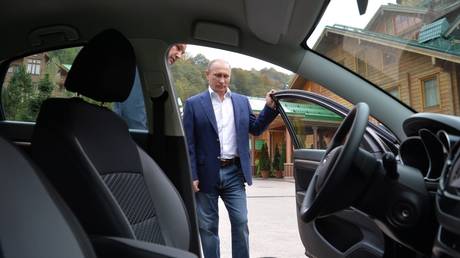 President Vladimir Putin observing the new AvtoVaz model "Lada Vesta" on October 22, 2015.