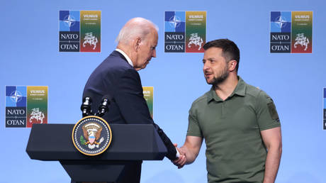 Ukrainian President Vladimir Zelensky shakes hands with US President Joe Biden on July 12 at the NATO summit in Vilnius, Lithuania.