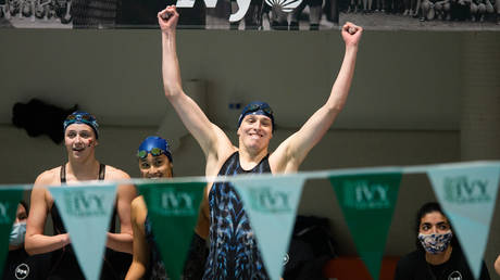 University of Pennsylvania swimmer Lia Thomas reacts after her team wins the 400 yard freestyle relay during the 2022 Ivy League Womens Swimming and Diving Championships at Blodgett Pool on February 19, 2022 in Cambridge, Massachusetts