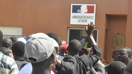 Protesters gather in front of the French Embassy in Niamey during a demonstration that followed a rally in support of Niger's junta in Niamey on July 30, 2023.