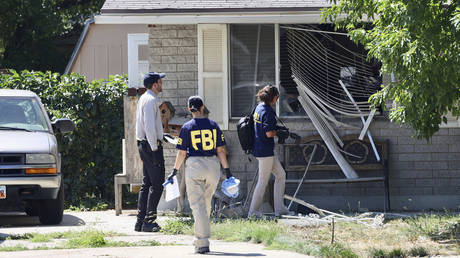 Law enforcement investigate the scene of a shooting involving the FBI, in Provo, Utah, August 9, 2023.