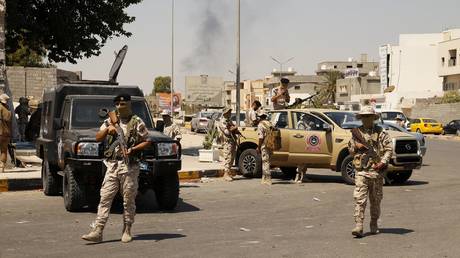 FILE PHOTO: Libyan army forces and vehicles are stationed in a street in the country’s capital of Tripoli on Friday, July 22 2022