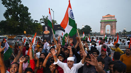 People celebrate the successful lunar landing of the Chandrayaan-3 spacecraft on the south pole of the Moon, in New Delhi, August 23, 2023