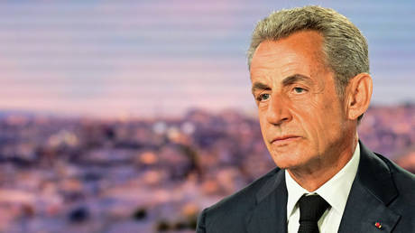 Former French President Nicolas Sarkozy looks on prior to an interview in the evening news broadcast of French TV channel TF1, on August 23, 2023.