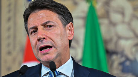 Leader of Italian populist Five Star movement Giuseppe Conte addresses he media on October 20, 2022 in Rome.