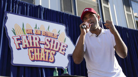 Republican presidential candidate Vivek Ramaswamy sings at the end of a Fair-Side Chat with Iowa Gov. Kim Reynolds at the Iowa State Fair, August 12, 2023