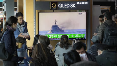 FILE PHOTO: A TV screen shows an image of a South Korean navy vessel during a news program at the Seoul Railway Station in Seoul, South Korea, October 24, 2022.