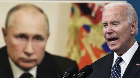 FILE PHOTO: An image of Russian President Vladimir Putin is displayed as US President Joe Biden speaks at the White House