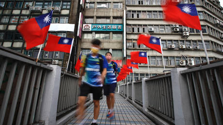 FILE PHOTO: A footbridge in Taipei decorated with Taiwan flags