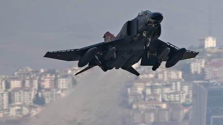 Warplane drops debris on parking lot (VIDEO)