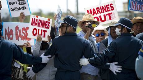 FILE PHOTO: Protestors rally against the US military presence in Okinawa in June 2016.