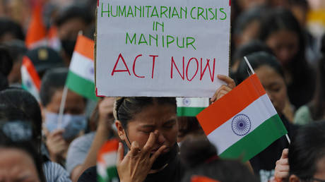 A woman cries during sit-in protest against violence in Manipur. The protest was held in New Delhi on May 29, 2023