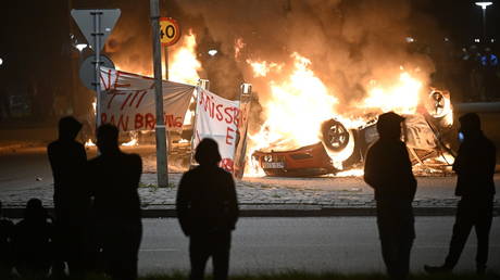 A banner with the text 'No to Koran burning', September 4, 2023, Malmo, Sweden.