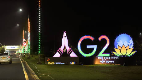 Traffics moves past an illuminated G20 logo near the airport ahead of this week’s summit of the Group of 20 nations in New Delhi, India, Wednesday, Sept. 6, 2023.