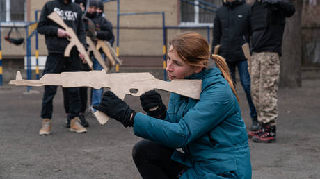 FILE PHOTO. A woman takes part in a basic military training session in Ivano-Frankovsk, Ukraine