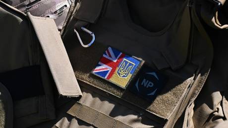 FILE PHOTO: A joint Union Jack and Ukrainian flag badge is pictured as Ukrainian soldiers take part in trench warfare exercises at a British Army military base in Northern England, June 2, 2023