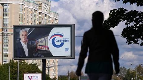 A pedestrian walks past a campaign billboard of Moscow mayor Sergey Sobyanin in Moscow, Russia, September 5, 2023