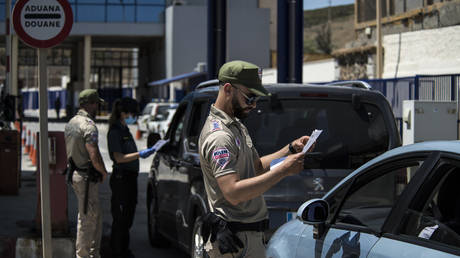 FILE PHOTO: A security guard at the international border in Ceuta, Spain