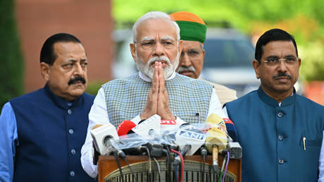 India's Prime Minister Narendra Modi along with lawmakers, addresses the media representatives upon his arrival to attend the special session of the parliament in New Delhi on September 18, 2023.
