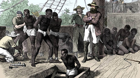 Captives being brought on board a slave ship on the West Coast of Africa, 1880.