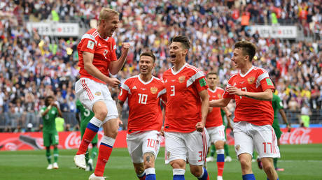 Iury Gazinsky of Russia celebrates with Fedor Smolov, Ilya Kutepov and Aleksandr Golovin after scoring the opening goal during the 2018 FIFA World Cup