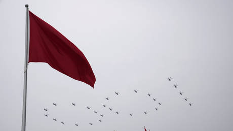 FILE PHOTO: Chinese military helicopters fly during a ceremony to mark the 100th anniversary of the founding of the ruling Chinese Communist Party, in Beijing, China, July 1, 2021.