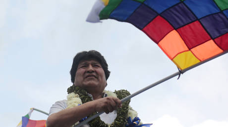 Former president of Bolivia Evo Morales waves a wiphala flag on his arrival after one year of political exile on November 11, 2020 in Chimoré, Bolivia.